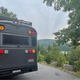 Image for article titled This Wild School Bus RV Has Underglow And A Fire Pit On Its Roof